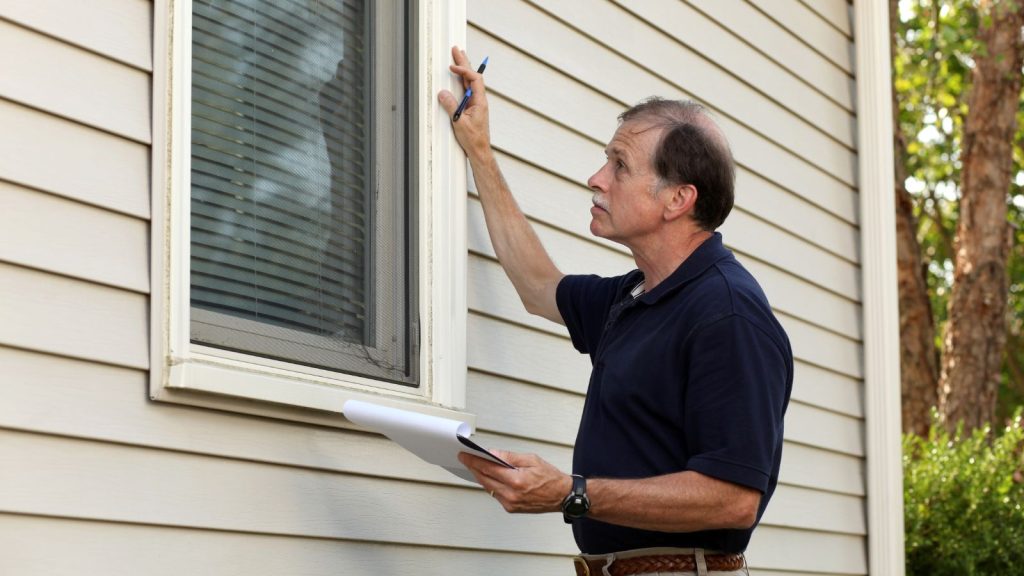 A certified inspector assesses window trim, conducts lead paint testing on Central NY home.